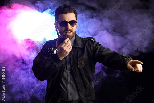 Male police officer with ra...