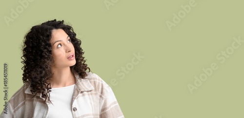 Young woman looking upward ...