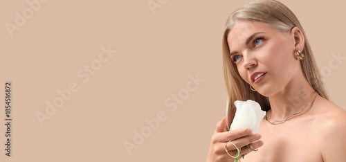 Blonde woman holding white ...