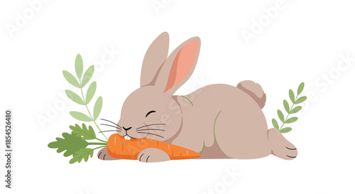 Adorable gray rabbit lying down and happily nibbling on a fresh orange carrot, surrounded by light green leaves.