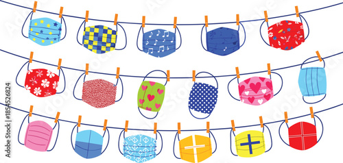 Colorful reusable fabric face masks hanging on clotheslines, symbolizing health safety, hygiene protection and pandemic prevention with cheerful decorative designs