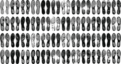 Large collection of black and white shoe sole footprints arranged in rows, detailed sneaker tread patterns, footwear texture set isolated