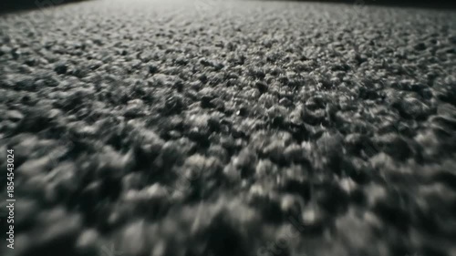 Close-up perspective of a textured surface in motion abstract background footage
