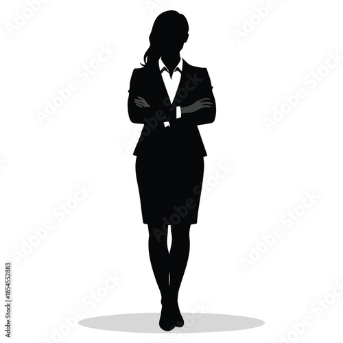 Silhouette of a businesswoman standing confidently with arms crossed