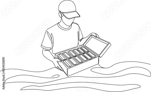 Man wearing a cap opens a tackle box filled with fishing lures