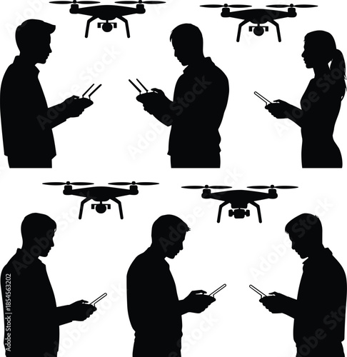 Four people operating drones with remote controls silhouette