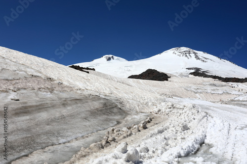 Snowy mountain peaks with deep blue sky