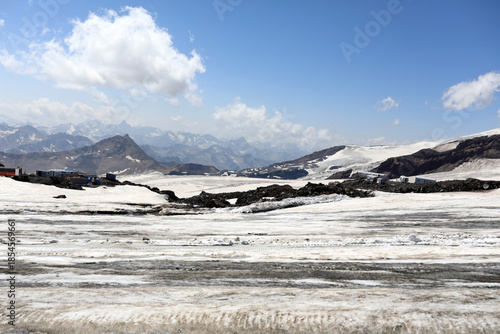 Snowy mountain landscape with rocky terrain