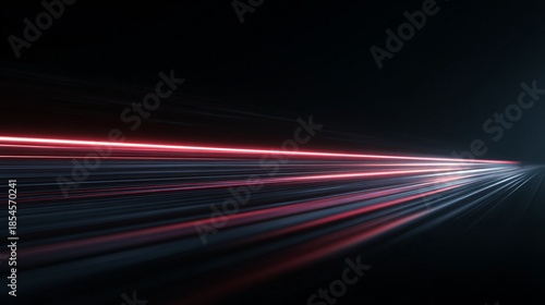 Abstract light trails on a dark background suggesting speed or movement.
