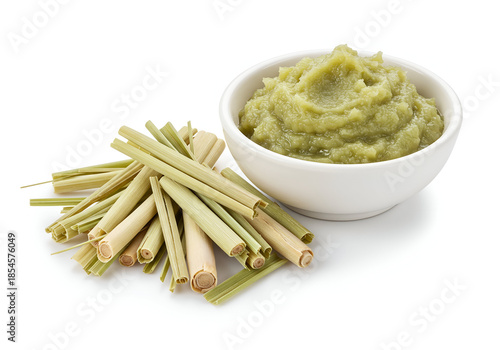 fresh lemongrass stalks with a bowl of green lemongrass paste for cooking use