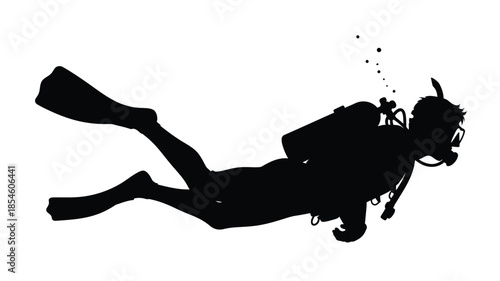 A scuba diver in motion swimming underwater in a dark silhouette