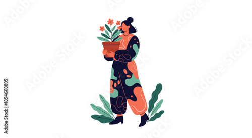 A stylish woman in a colorful, abstract-patterned jumpsuit is standing among plants and holding a large pot with flowers.