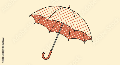 Stylish open umbrella with a peach background and white polka dots held by a brown curved handle against a plain cream background.