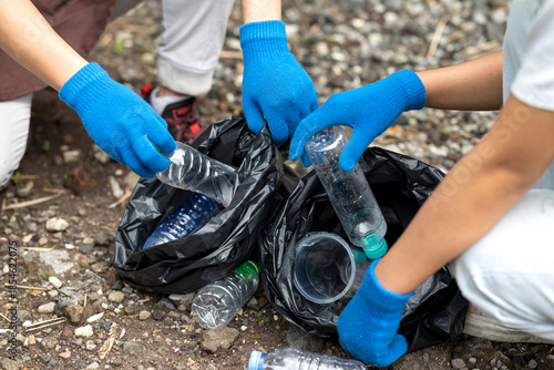Photos Volunteers wearing aprons and gloves in a cleanup activity