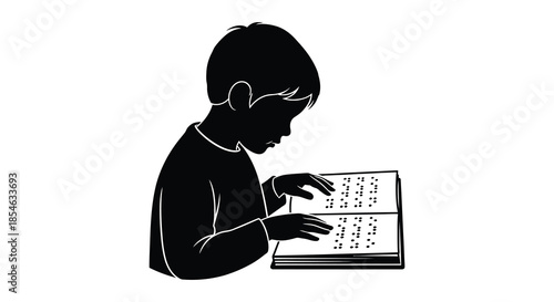 A young boy intently reading a book with braille depicted in a striking silhouette