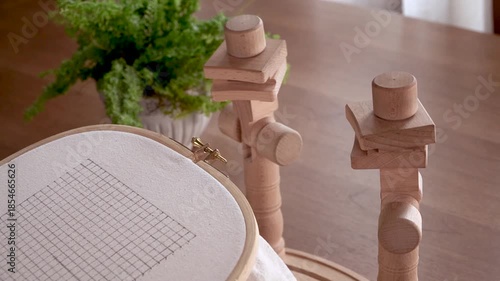 Comfortable Crafting: Fixing a Wooden Embroidery Hoop onto a Table Stand for Relaxing Stitching.