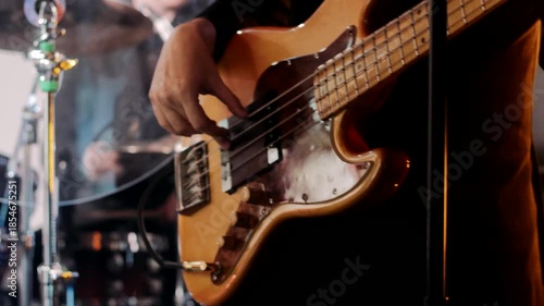 A guitarist plays an electric guitar close-up