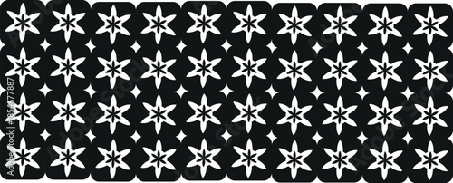 Black and white snowflake patterned rug or mat with scalloped edges