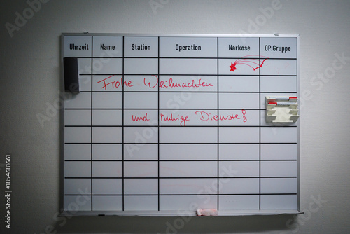 ritten in red marker is a festive holiday message in German, wishing “Merry Christmas and quiet shifts,” adding a human and emotional touch to a clinical environment