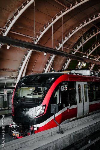 train in the subway station with red livery