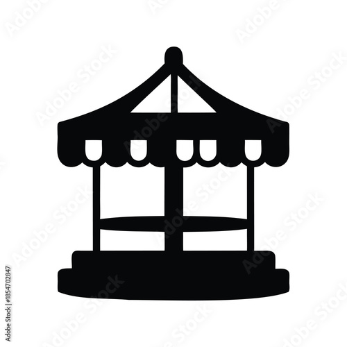 Silhouette of a classic carnival carousel with an elegant tent roof style