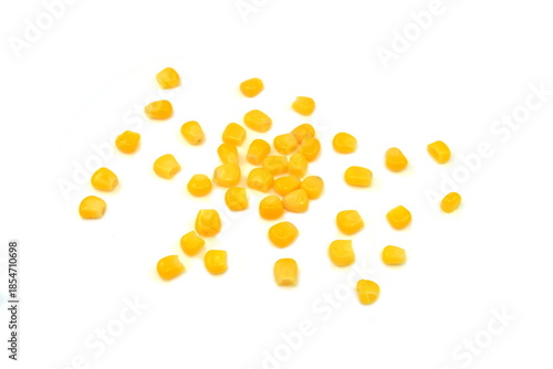 Sweet corn kernels isolated on white. Cooked canned yellow vegetable maize, Zea mays, also called sugar or pole corn, a vegetarian staple food. Isolated macro food photo close up from above. 