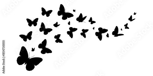 Black butterflies flying in formation on white background