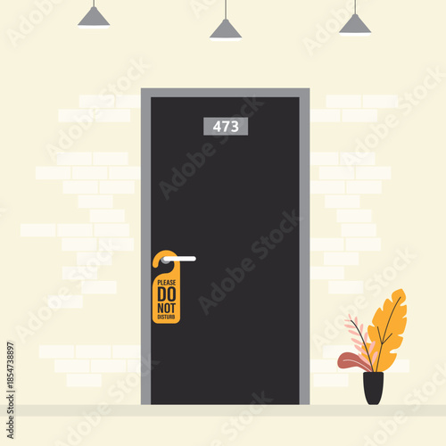 Hotel hallway, a do not disturb sign hanging on a doorknob. Interior of hotel corridor.