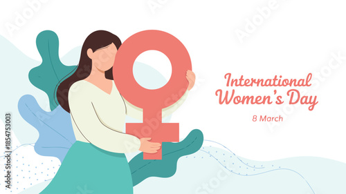 Woman proudly holding a large pink female gender symbol for International Womens Day celebration