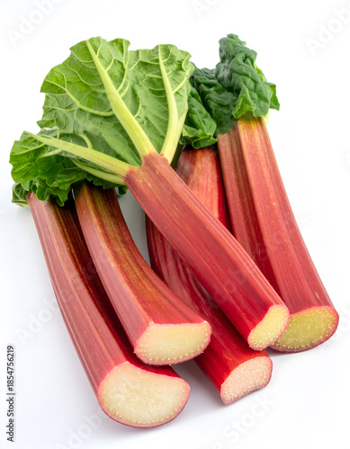 Fresh Rhubarb Stalks with Green Leaves Isolated on White Background
