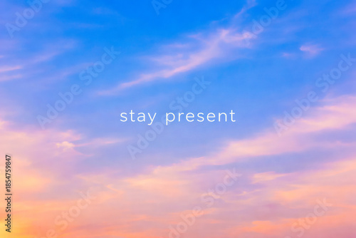 Horizontal Stay Present quote over soft pastel sky gradient with calm blue and peach tones, minimalist inspirational illustration for mindfulness practice, meditation content, wellness branding