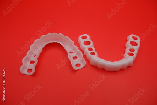 Dental Implant Surgical Guide on Red Background