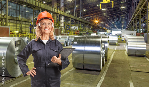 Quadro su tela Professional woman working in a steel factory