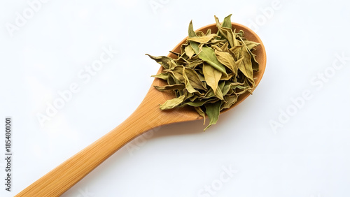 Dried Senna Leaves on Wooden Spoon for Herbal Medicine