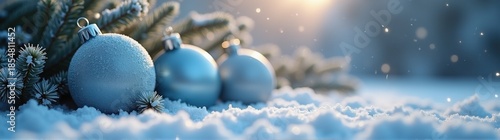 Blue christmas balls sitting on a snowy surface