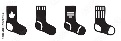 Four black sock icons with various patterns are neatly arranged in a row, representing comfortable and stylish footwear for everyday wear.