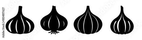 Four garlic bulbs in silhouette
