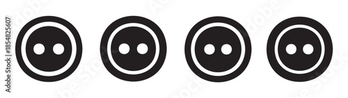 Four black sewing buttons with two holes each are neatly aligned in a row, representing a classic design element for fashion and crafts.