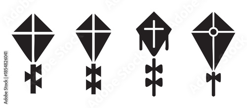 Four black silhouette kites with various tail designs are depicted in a graphic vector illustration, representing freedom and playfulness.