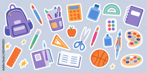 Colorful school supplies and stationery items arranged on a light blue backdrop