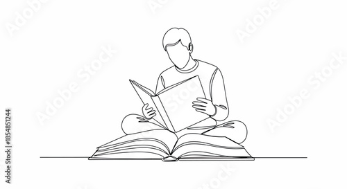 Man sitting cross-legged reading a book