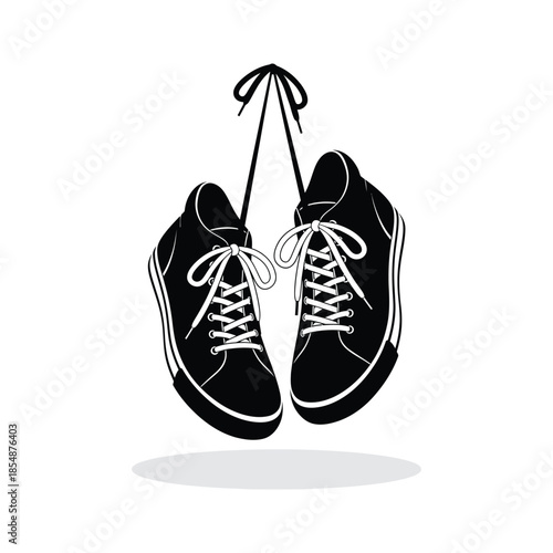 Hanging sneakers with laces displayed a striking black and white image silhouette
