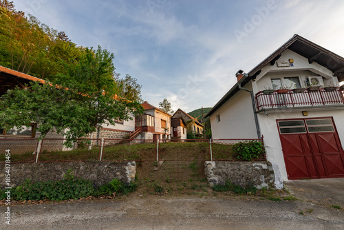 House with a red door and a white roof