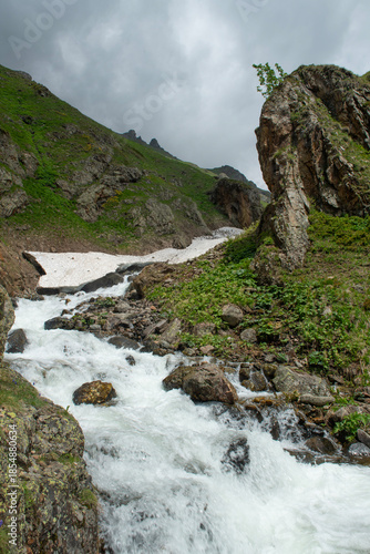 Snow melting in the Ovit Plateau in Rize. Snow turning into streams in autumn. Glaciers melting in spring. A view of snow and streams on a sunny day. Ovit Pass. Magnificent views from the Ovit Plateau
