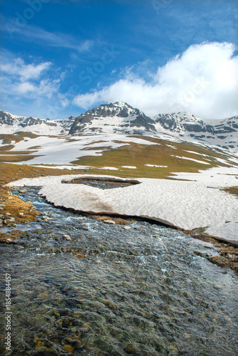 Snow melting in the Ovit Plateau in Rize. Snow turning into streams in autumn. Glaciers melting in spring. A view of snow and streams on a sunny day. Ovit Pass. Magnificent views from the Ovit Plateau