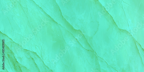 An abstract close up view of a textured green surface resembling rippled sand or swirling marble patterns