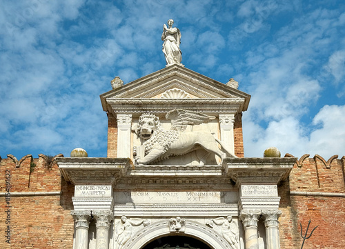 Stone Lion of Saint Mark above the main gate at the Arsenal, Venice, Italy