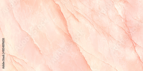 A close up view of a delicate peach colored marble texture showcasing natural veining and subtle color variations