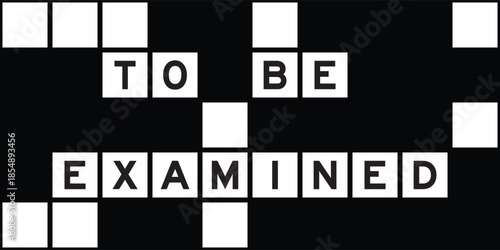 Alphabet letter in word to be examined on crossword puzzle background