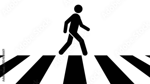 A person walks across a street on a crosswalk marked by black stripes.